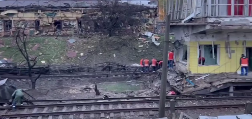 Damaged buildings and railway tracks near the «Chernihivska» underground station in Kyiv following Russian shelling.