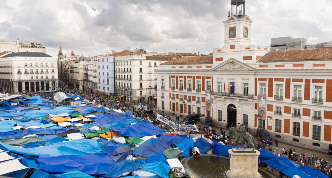 Protest in Madrid’s Puerta del Sol square The tent city and protesters in Madrid’s Puerta del Sol square