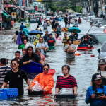 Bangkok on the brink: floods have turned the streets into lakes, with around 40 people killed