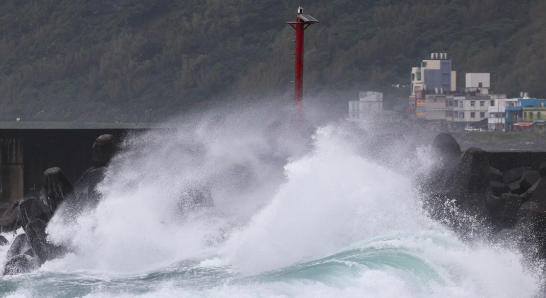 Powerful storm surges crash against the breakwater in the Taiwanese city of Keelung during Typhoon Champi.