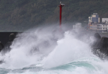 Powerful storm surges crash against the breakwater in the Taiwanese city of Keelung during Typhoon Champi.