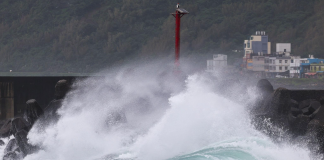Powerful storm surges crash against the breakwater in the Taiwanese city of Keelung during Typhoon Champi.