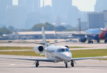 The world’s richest people profit from climate disasters A private business jet on the airport taxiway