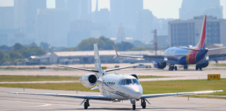 The world’s richest people profit from climate disasters A private business jet on the airport taxiway
