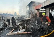 Х-101, «Калібри» та балістика: наслідки масованої атаки РФ Рятувальник серед згорілих автомобілів після удару по Києву