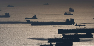The US is preparing to bring the “shadow fleet” tankers back into legal service The silhouettes of oil tankers and other vessels at sea