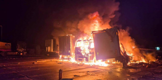 Lorries and trailers engulfed in flames on the premises of a civilian enterprise in the Sarny district of the Rivne region