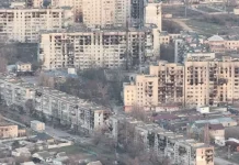 The EU is calling for urgent humanitarian access to Oleshky Damaged and partially destroyed residential buildings in Oleshky, Kherson Oblast