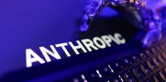 Anthropic has disclosed its financial results ahead of its IPO The Anthropic logo on a computer screen next to a keyboard, bathed in purple-blue light.