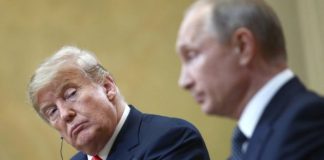 Democrats are preparing an inquiry into Trump’s deal with Putin Donald Trump looks in the direction of Vladimir Putin during a joint meeting