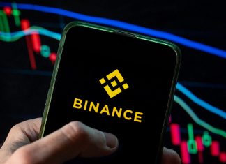 Binance suffered a massive hack amounting to $6.3 billion: the exchange has suspended withdrawals The Binance cryptocurrency exchange logo on a smartphone screen