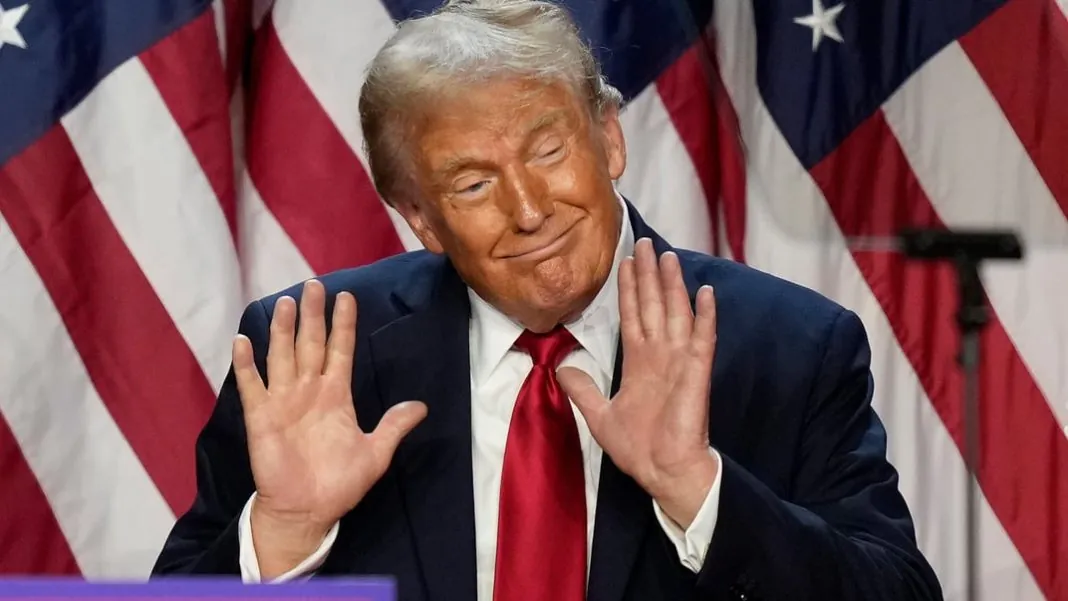 hjt42y Дональд Трамп у темному костюмі та червоній краватці