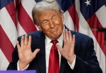 Трамп образив Норвегію після рішення Нобелівського комітету Дональд Трамп у темному костюмі та червоній краватці