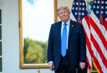 Trump has once again blamed Ukraine for the rise in petrol prices in the US Donald Trump against a backdrop of US flags whilst making a statement