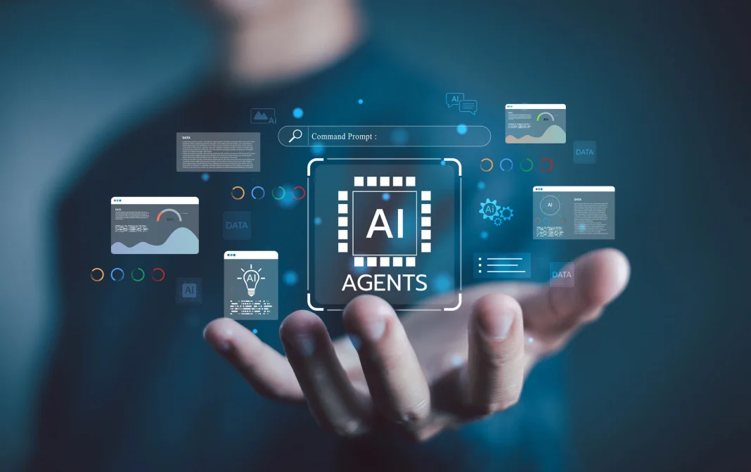 AI Agents A hand is holding a virtual interface displaying the words ‘AI Agents’, data windows and a command line