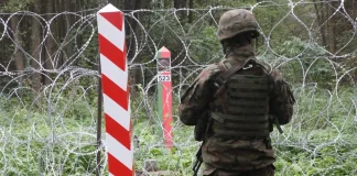 An armed group crossed from Belarus into Latvia: what happened at the border A Latvian soldier near the fortified border with Belarus