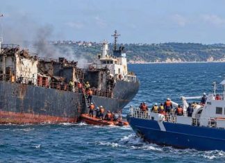 A merchant vessel and a lifeboat damaged by fire at sea off the coast of Bulgaria