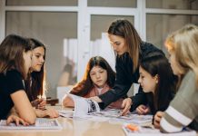 The Ministry of Education and Science has begun training career advisers for schools The teacher helps the schoolgirls work through the learning materials