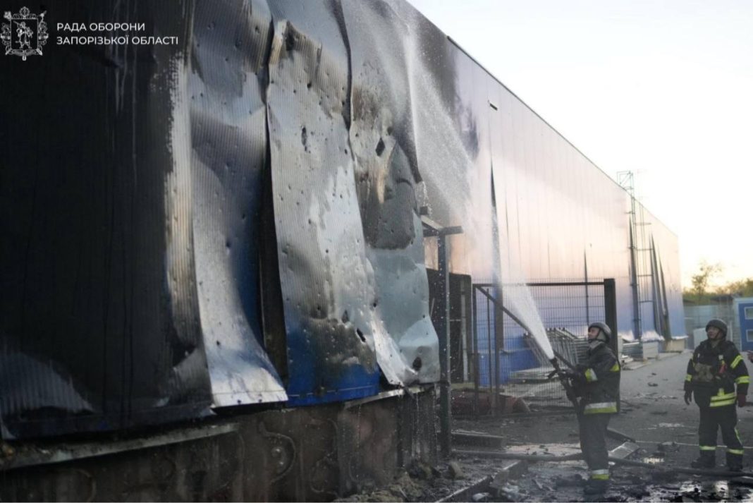 Rescue workers near a commercial building in Zaporizhzhia damaged by a Russian strike on 25 October 2026.