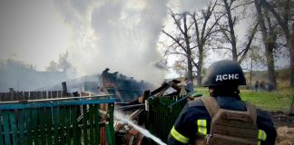 A firefighter puts out a fire in the Chernihiv region