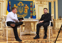 Ukrainian President Volodymyr Zelenskyy in a black suit during an interview