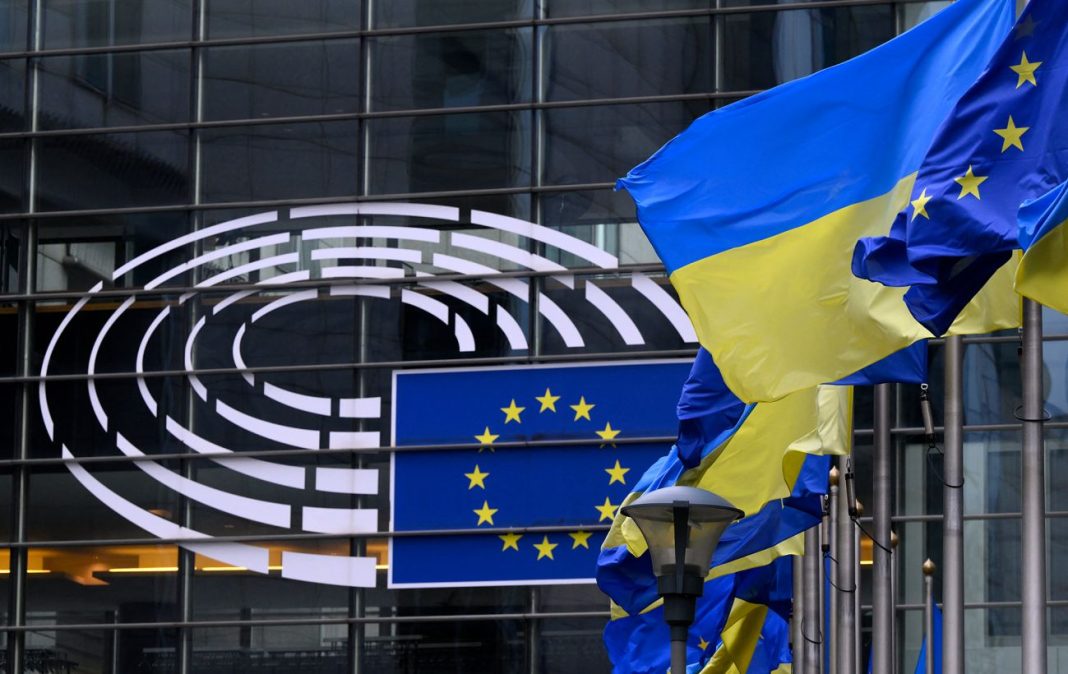 EU loan The flags of Ukraine and the European Union outside the European Parliament building