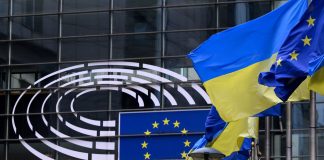 The flags of Ukraine and the European Union outside the European Parliament building