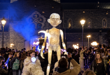 A spectacular Halloween parade featuring giant puppets took place in Ireland A giant illuminated puppet amongst the crowd of spectators at a night-time Halloween parade in Ireland